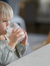 Toddler drinking milk from glass